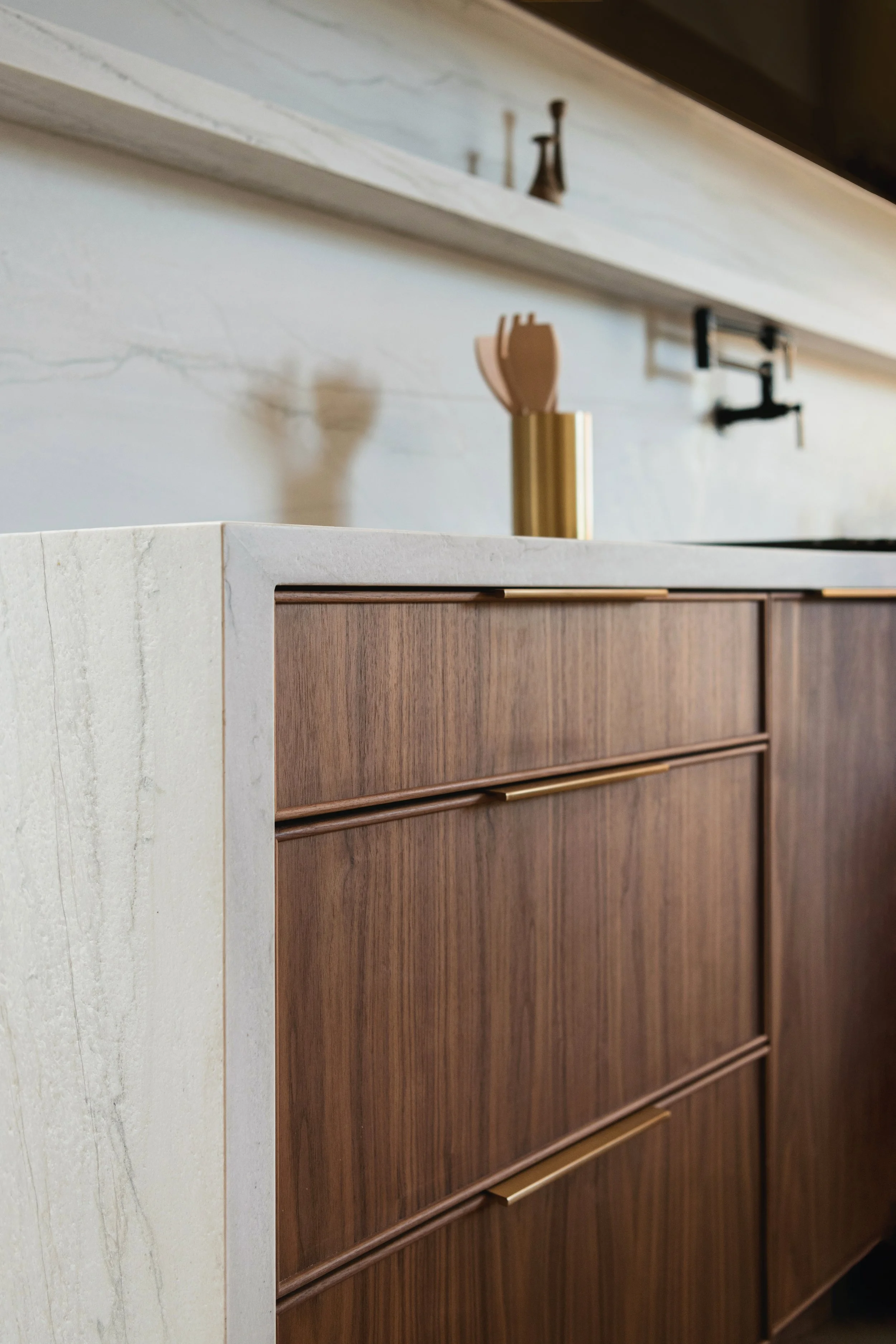 Walnut Honey Cabinetry drawers and stone counter detail